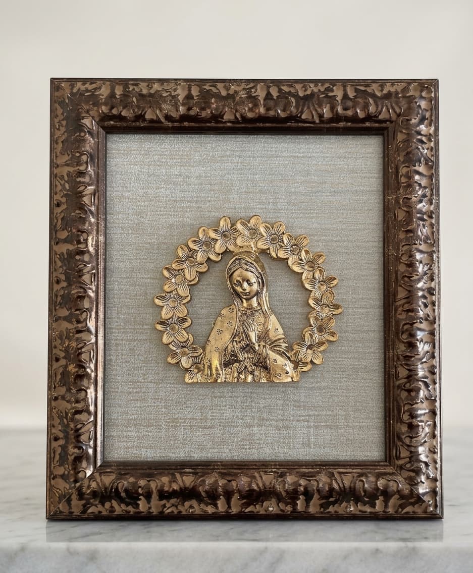 Bronze-patina Virgin Mary linen frame with a brass floral medallion